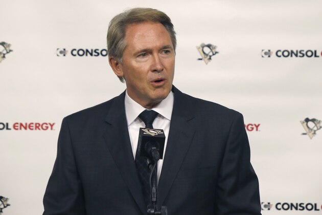 Mike Johnston answers questions at a news conference after the Pittsburgh Penguins introduced him as the NHL hockey team's new coach on Wednesday, June 25, 2014 in Pittsburgh. (AP Photo/Keith Srakocic)