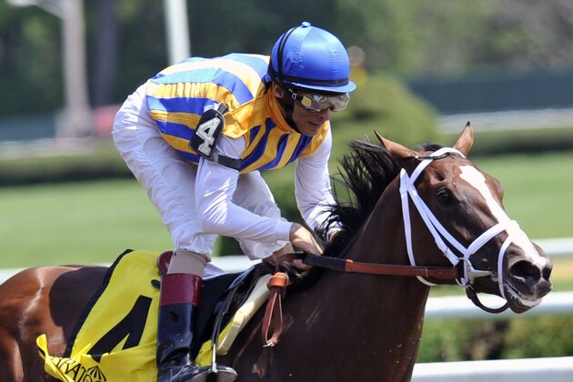 Fashion Alert, ridden by John R. Velazquez, wins the Schuylerville Stakes on opening day of the horse racing season at Saratoga Race Course in Saratoga Springs, N.Y., Friday, July 18, 2014. (AP Photo/Hans Pennink)