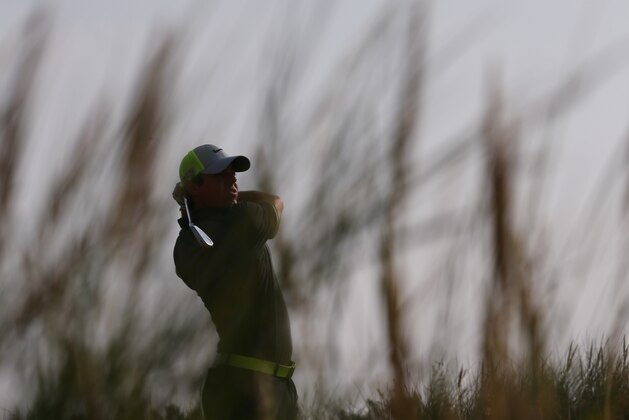 Rory McIlroy of Northern Ireland plays a shot off the 13th tee during the second day of the British Open Golf championship at the Royal Liverpool golf club, Hoylake, England, Friday July 18, 2014. (AP Photo/Scott Heppell)
