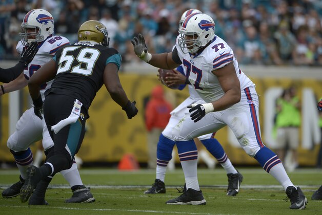 Buffalo Bills guard Doug Legursky, left, and tackle Cordy Glenn (77) block against Jacksonville Jaguars defensive end Ryan Davis (59) during the first half of an NFL football game in Jacksonville, Fla., Sunday, Dec. 15, 2013.(AP Photo/Phelan M. Ebenhack)