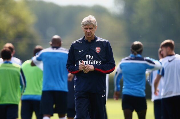 ST ALBANS, ENGLAND - MAY 14: Arsene Wenger of Arsenal looks on during a training session ahead of the FA Cup Final match between Arsenal and Hull City at London Colney on May 14, 2014 in St Albans, England. (Photo by Clive Mason/Getty Images) ST ALBANS, ENGLAND - MAY 14: Arsene Wenger of Arsenal looks on during a training session ahead of the FA Cup Final match between Arsenal and Hull City at London Colney on May 14, 2014 in St Albans, England. (Photo by Clive Mason/Getty Images)