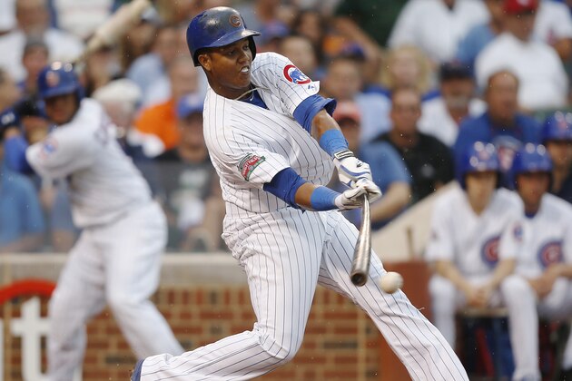 Chicago Cubs' Starlin Castro hits a single against the Atlanta Braves during the sixth inning of a baseball game on Friday, July 11, 2014, in Chicago. (AP Photo/Andrew A. Nelles)