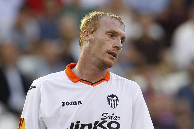 Valencia's Jeremy Mathieu from France, looks toward the ground after failing to score against  against Swansea City during their Europa  League Group A soccer match at the Mestalla stadium in Valencia, Spain, Thursday , Sept. 19, 2013. (AP Photo/Alberto Saiz)