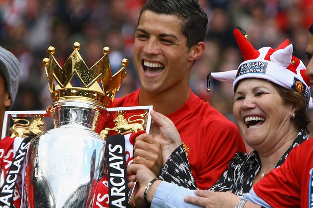 MANCHESTER, ENGLAND - MAY 16:  Cristiano Ronaldo of Manchester United celebrates winning the Barclays Premier League trophy with his mother, Dolores Aveiro after the Barclays Premier League match between Manchester United and Arsenal at Old Trafford on May 16, 2009 in Manchester, England.  (Photo by Alex Livesey/Getty Images)