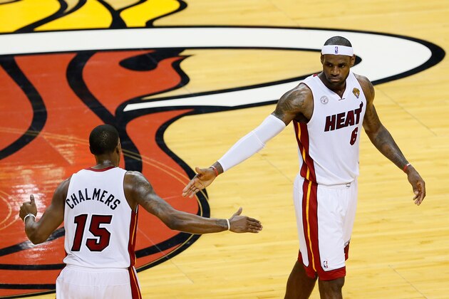 MIAMI, FL - JUNE 18:  LeBron James #6 gives teammate Mario Chalmers #15 of the Miami Heat a five in the first half against the San Antonio Spurs during Game Six of the 2013 NBA Finals at AmericanAirlines Arena on June 18, 2013 in Miami, Florida. NOTE TO USER: User expressly acknowledges and agrees that, by downloading and or using this photograph, User is consenting to the terms and conditions of the Getty Images License Agreement.  (Photo by Kevin C. Cox/Getty Images)