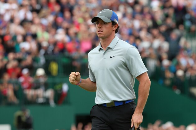 HOYLAKE, ENGLAND - JULY 19:  Rory McIlroy of Northern Ireland celebrates holing an eagle putt on the 18th green during the third round of The 143rd Open Championship at Royal Liverpool on July 19, 2014 in Hoylake, England.  (Photo by Andrew Redington/Getty Images)