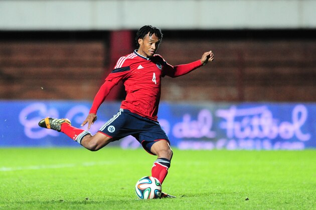 BUENOS AIRES, ARGENTINA - JUNE 06: Juan Cuadrado of Colombia shoots a penalty kick to score the second goal during the International Friendly Match between Colombia and Jordan at Pedro Bidegain Stadium on June 06, 2014 in Buenos Aires, Argentina. (Photo by Alfredo Herms/Getty Images)