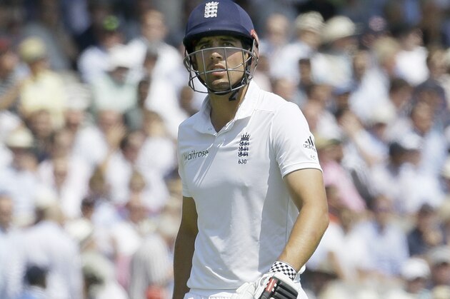 England's captain Alastair Cook leaves the field after being caught by M S Dhoni off the bowling of India's Bhuvneshwar Kumar during the second day of the second test match between England and India at Lord's cricket ground in London, Friday, July 18, 2014. (AP Photo/Kirsty Wigglesworth)