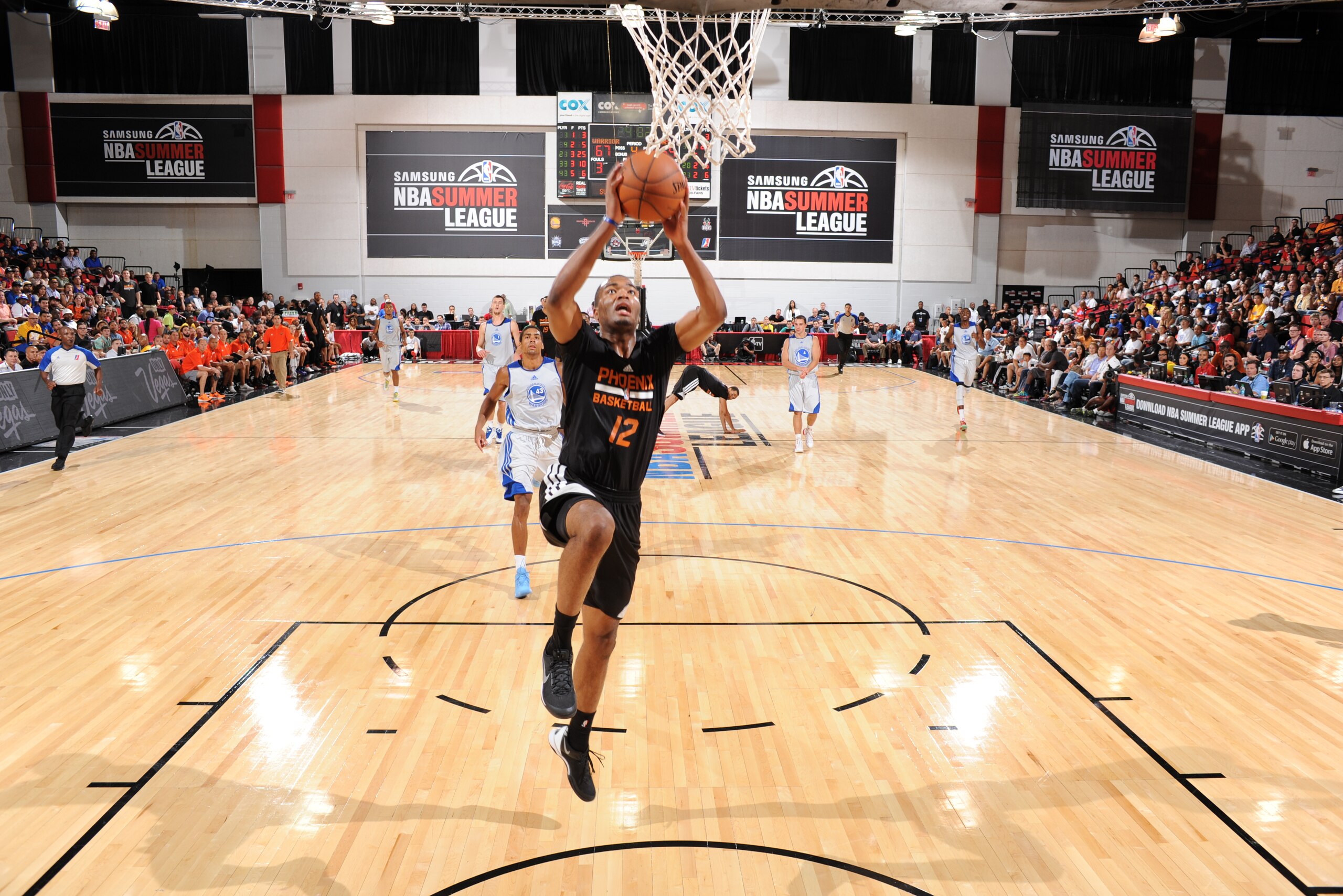 LAS VEGAS, NV - JULY 12: T.J. Warren #12 of the Phoenix Suns goes up for a shot against the Golden State Warriors at the Samsung NBA Summer League 2014 on July 12, 2014 at the Cox Pavilion in Las Vegas, Nevada. NOTE TO USER: User expressly acknowledges and agrees that, by downloading and or using this photograph, User is consenting to the terms and conditions of the Getty Images License Agreement. Mandatory Copyright Notice: Copyright 2014 NBAE (Photo by Garrett Ellwood/NBAE via Getty Images)