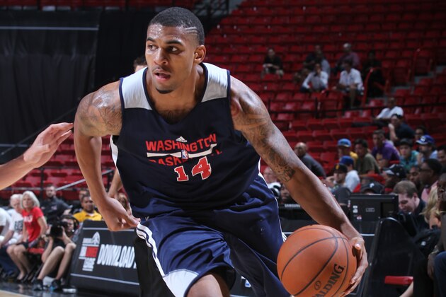 LAS VEGAS, NV - JULY 13: Glen Rice Jr. #14 of the Washington Wizards handles the ball against the Minnesota Timberwolves at the Samsung NBA Summer League 2014 on July 13, 2014 at the Thomas & Mack Center in Las Vegas, Nevada. NOTE TO USER: User expressly acknowledges and agrees that, by downloading and or using this photograph, User is consenting to the terms and conditions of the Getty Images License Agreement. Mandatory Copyright Notice: Copyright 2014 NBAE (Photo by Jack Arent/NBAE via Getty Images)