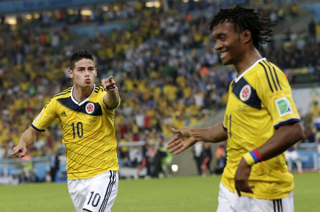 Colombia's James Rodriguez, left, celebrates with his teammate Juan Cuadrado after he scored his side's second goal during the World Cup round of 16 soccer match between Colombia and Uruguay at the Maracana Stadium in Rio de Janeiro, Brazil, Saturday, June 28, 2014. (AP Photo/Marcio Jose Sanchez) Colombia's James Rodriguez, left, celebrates with his teammate Juan Cuadrado after he scored his side's second goal during the World Cup round of 16 soccer match between Colombia and Uruguay at the Maracana Stadium in Rio de Janeiro, Brazil, Saturday, June 28, 2014. (AP Photo/Marcio Jose Sanchez)