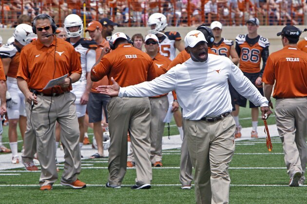 Texas coach Charlie Strong calls out to his players during the first half of the team's Orange and White spring NCAA college football game, Saturday, April 19, 2014, in Austin, Texas.  (AP Photo/Michael Thomas)