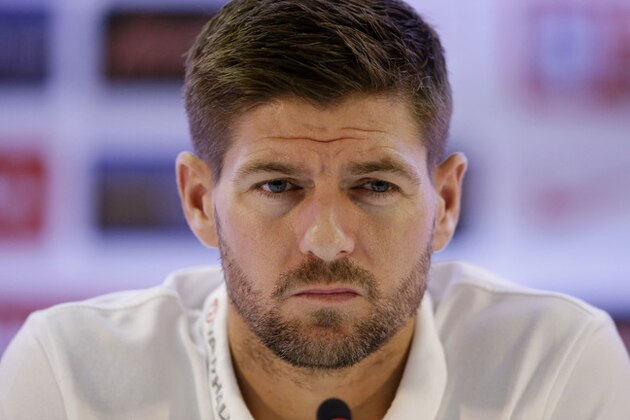 England national soccer team captain Steven Gerrard listens as head coach Roy Hodgson speaks during a press conference after a squad training session that was closed to the media for the 2014 soccer World Cup at the Urca military base in Rio de Janeiro, Brazil, Sunday, June 22, 2014.  Costa Rica's surprise 1-0 win over Italy on Friday meant that England made its most humiliating exit from a World Cup since 1958, following consecutive defeats by the Italians and then Uruguay in Group D.  England play Costa Rica in their final Group D match on Tuesday.  (AP Photo/Matt Dunham)