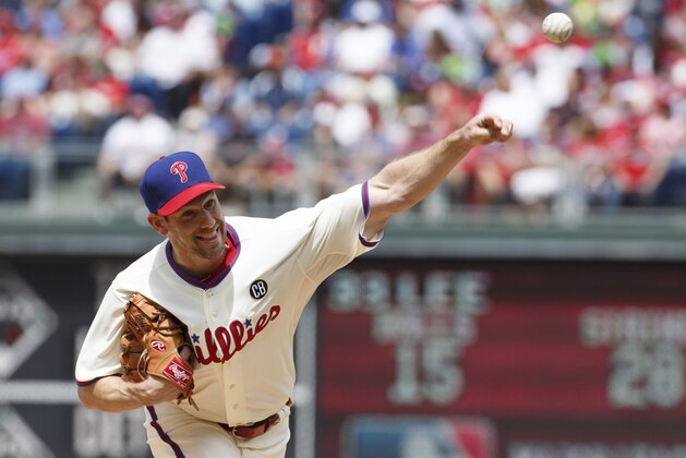 Philadelphia Phillies starting pitcher Cliff Lee pitches during the third inning of a baseball game against the Cincinnati Reds, Sunday, May 18, 2014, in Philadelphia. The Phillies won 8-3. (AP Photo/Chris Szagola)