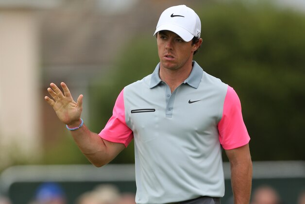 Rory McIlroy of Northern Ireland waves to the crowd after playing a birdie on the 1st hole during the final round of the British Open Golf championship at the Royal Liverpool golf club, Hoylake, England, Sunday July 20, 2014. (AP Photo/Peter Morrison)