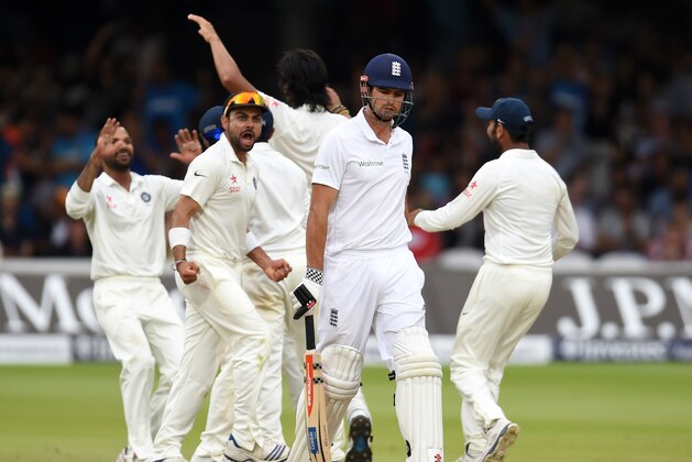 LONDON, ENGLAND - JULY 20:  England batsman Alastair Cook leaves the crease after being dismissed as the India fielders celebrate during day four of 2nd Investec Test match between England and India at Lord's Cricket Ground on July 20, 2014 in London, United Kingdom.  (Photo by Stu Forster/Getty Images)