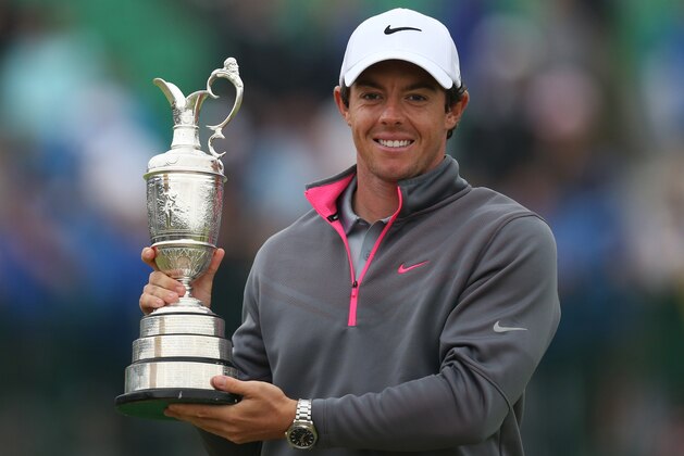 Rory McIlroy of Northern Ireland holds up the Claret Jug trophy after winning the British Open Golf championship at the Royal Liverpool golf club, Hoylake, England, Sunday July 20, 2014. (AP Photo/Scott Heppell)