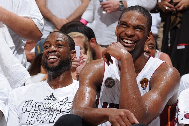 MIAMI, FL - JUNE 9: Chris Bosh #1, LeBron James #6, and Dwyane Wade #3 of the Miami Heat share a laugh on the bench during Game Two of the 2013 NBA Finals against the San Antonio Spurs on June 9, 2013 at American Airlines Arena in Miami, Florida. NOTE TO USER: User expressly acknowledges and agrees that, by downloading and or using this photograph, User is consenting to the terms and conditions of the Getty Images License Agreement. Mandatory Copyright Notice: Copyright 2013 NBAE (Photo by Andrew D. Bernstein/NBAE via Getty Images)