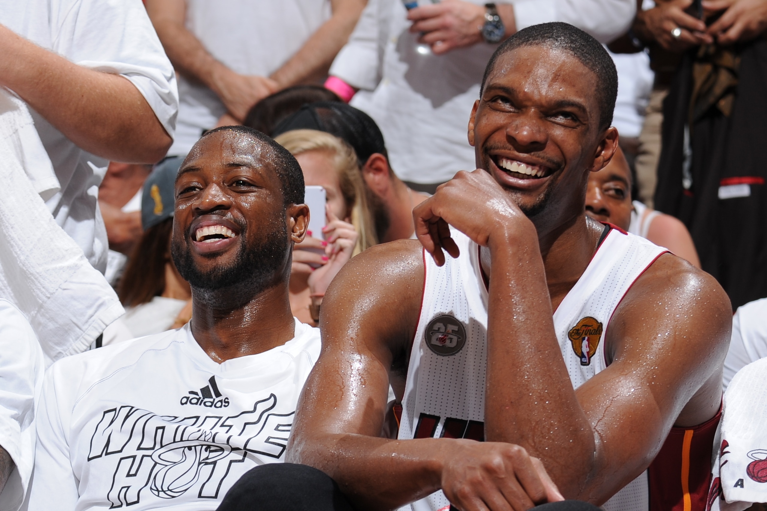 MIAMI, FL - JUNE 9: Chris Bosh #1, LeBron James #6, and Dwyane Wade #3 of the Miami Heat share a laugh on the bench during Game Two of the 2013 NBA Finals against the San Antonio Spurs on June 9, 2013 at American Airlines Arena in Miami, Florida. NOTE TO USER: User expressly acknowledges and agrees that, by downloading and or using this photograph, User is consenting to the terms and conditions of the Getty Images License Agreement. Mandatory Copyright Notice: Copyright 2013 NBAE (Photo by Andrew D. Bernstein/NBAE via Getty Images)