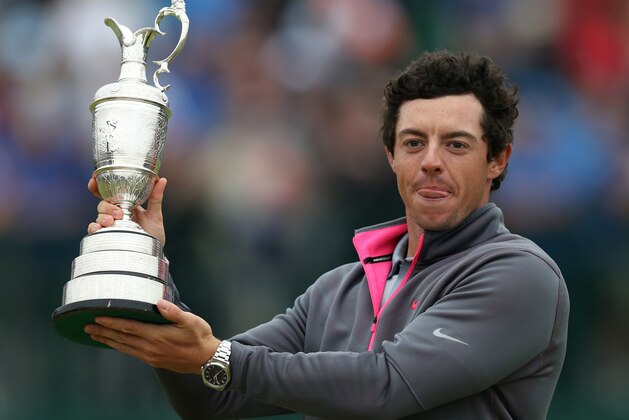 Rory McIlroy of Northern Ireland holds up the Claret Jug trophy after winning the British Open Golf championship at the Royal Liverpool golf club, Hoylake, England, Sunday July 20, 2014. (AP Photo/Scott Heppell)