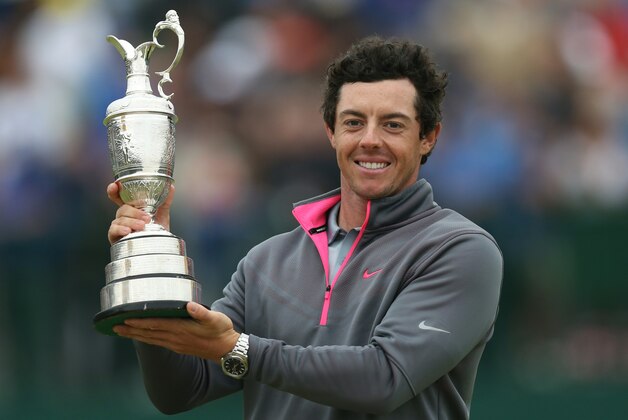 Rory McIlroy of Northern Ireland holds up the Claret Jug trophy after winning the British Open Golf championship at the Royal Liverpool golf club, Hoylake, England, Sunday July 20, 2014. (AP Photo/Scott Heppell)