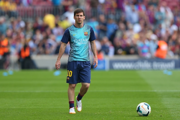 BARCELONA, SPAIN - MAY 17:  Lionel Messi of FC Barcelona warms up prior to the La Liga match between FC Barcelona and Club Atletico de Madrid at Camp Nou on May 17, 2014 in Barcelona, Spain.  (Photo by Alex Livesey/Getty Images)