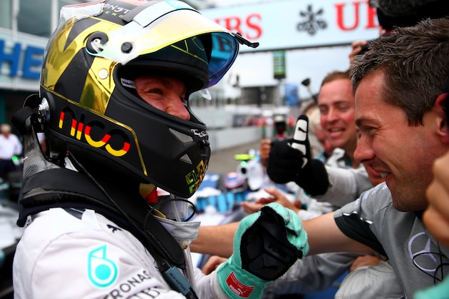 HOCKENHEIM, GERMANY - JULY 20:  Nico Rosberg of Germany and Mercedes GP celebrates in Parc Ferme after victory in the German Grand Prix at Hockenheimring on July 20, 2014 in Hockenheim, Germany.  (Photo by Dan Istitene/Getty Images)