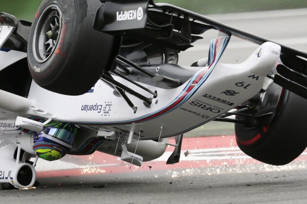Williams driver Felipe Massa of Brazil crashes in the first curve of the German Formula One Grand Prix in Hockenheim, Germany, Sunday, July 20, 2014. (AP Photo/Petr David Josek)