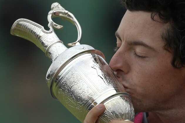 Rory McIlroy of Northern Ireland kisses the Claret Jug trophy after winning the British Open Golf championship at the Royal Liverpool golf club, Hoylake, England, Sunday July 20, 2014. (AP Photo/Peter Morrison)