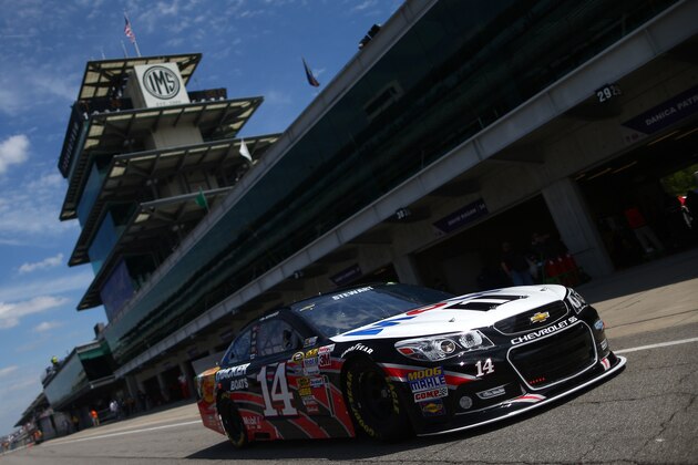 INDIANAPOLIS, IN - JULY 26: Tony Stewart drives the #14 Bass Pro Shops/Mobil 1 Chevrolet through the garage area during practice for the NASCAR Sprint Cup Series Samuel Deeds 400 At The Brickyard at Indianapolis Motor Speedway on July 26, 2013 in Indianapolis, Indiana. (Photo by Chris Graythen/Getty Images) INDIANAPOLIS, IN - JULY 26: Tony Stewart drives the #14 Bass Pro Shops/Mobil 1 Chevrolet through the garage area during practice for the NASCAR Sprint Cup Series Samuel Deeds 400 At The Brickyard at Indianapolis Motor Speedway on July 26, 2013 in Indianapolis, Indiana. (Photo by Chris Graythen/Getty Images)