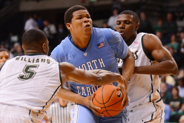 Dec 1, 2013; Birmingham, AL, USA; North Carolina Tar Heels forward Isaiah Hicks (22) is surrounded by UAB Blazers guard Robert Williams (5) and forward Tosin Mehiniti (21) during the second half at Bartow Arena. UAB upset North Carolina 63-59. Mandatory Credit: Kelly Lambert-USA TODAY Sports
