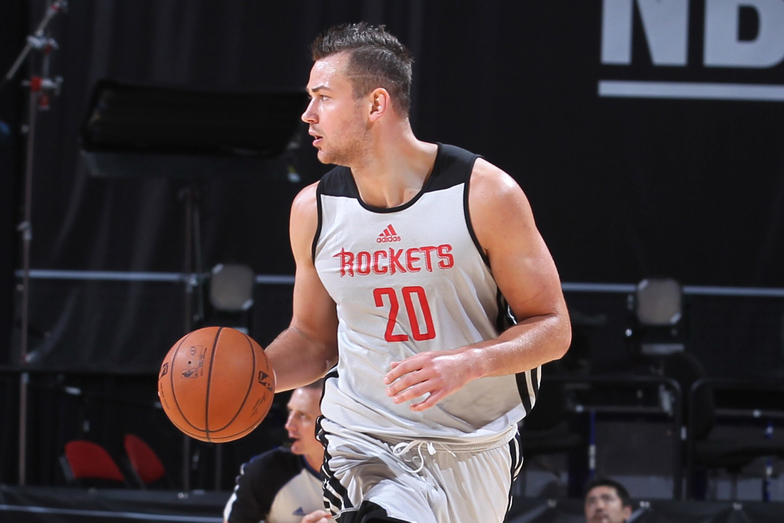 LAS VEGAS, NV - JULY 16: Donatas Motiejunas #20 of the Houston Rockets handles the ball against the Toronto Raptors on July 16, 2014 at the Thomas & Mack Center in Las Vegas, Nevada. NOTE TO USER: User expressly acknowledges and agrees that, by downloading and or using this photograph, User is consenting to the terms and conditions of the Getty Images License Agreement. Mandatory Copyright Notice: Copyright 2014 NBAE (Photo by Jack Arent/NBAE via Getty Images) LAS VEGAS, NV - JULY 16: Donatas Motiejunas #20 of the Houston Rockets handles the ball against the Toronto Raptors on July 16, 2014 at the Thomas & Mack Center in Las Vegas, Nevada. NOTE TO USER: User expressly acknowledges and agrees that, by downloading and or using this photograph, User is consenting to the terms and conditions of the Getty Images License Agreement. Mandatory Copyright Notice: Copyright 2014 NBAE (Photo by Jack Arent/NBAE via Getty Images)