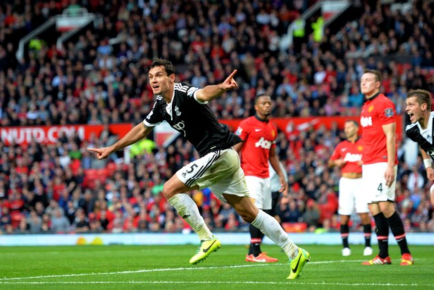 MANCHESTER, ENGLAND - OCTOBER 19:  Dejan Lovren of Southampton celebrates after scoring a late goal to level the scores at 1-1 during the Barclays Premier League match between Manchester United and Southampton at Old Trafford on October 19, 2013 in Manchester, England.  (Photo by Shaun Botterill/Getty Images)