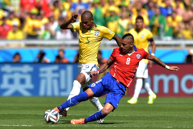 BELO HORIZONTE, BRAZIL - JUNE 28: Arturo Vidal of Chile challenges Fernandinho of Brazil during the 2014 FIFA World Cup Brazil round of 16 match between Brazil and Chile at Estadio Mineirao on June 28, 2014 in Belo Horizonte, Brazil. (Photo by Buda Mendes/Getty Images) BELO HORIZONTE, BRAZIL - JUNE 28: Arturo Vidal of Chile challenges Fernandinho of Brazil during the 2014 FIFA World Cup Brazil round of 16 match between Brazil and Chile at Estadio Mineirao on June 28, 2014 in Belo Horizonte, Brazil. (Photo by Buda Mendes/Getty Images)