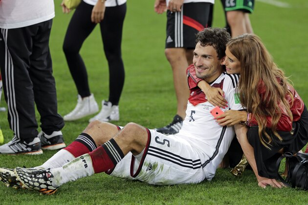 Germany's Mats Hummels is embraced by his partner Cathy Fischer after the World Cup final soccer match between Germany and Argentina at the Maracana Stadium in Rio de Janeiro, Brazil, Sunday, July 13, 2014. Germany won the match 1-0. (AP Photo/Matthias Schrader) Germany's Mats Hummels is embraced by his partner Cathy Fischer after the World Cup final soccer match between Germany and Argentina at the Maracana Stadium in Rio de Janeiro, Brazil, Sunday, July 13, 2014. Germany won the match 1-0. (AP Photo/Matthias Schrader)