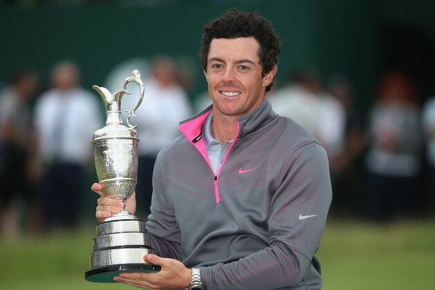 HOYLAKE, ENGLAND - JULY 20:  Rory McIlroy of Northern Ireland holds the Claret Jug after his two-stroke victory at The 143rd Open Championship at Royal Liverpool on July 20, 2014 in Hoylake, England.  (Photo by Andrew Redington/Getty Images)
