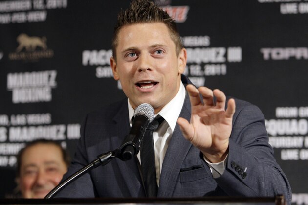 WWE Champion The Miz, center, speaks at a news conference to promote a world welterweight champioship bout between Manny Pacquiao, of the Philippines, and Juan Manuel Marquez, of Mexico, Pacquiao-Marquez III, in Beverly Hills, Calif., Wednesday, Sept. 7, 2011.  The fighters will meet Saturday, Nov. 12, 2011, at the MGM Grand in Las Vegas. (AP Photo/Reed Saxon)