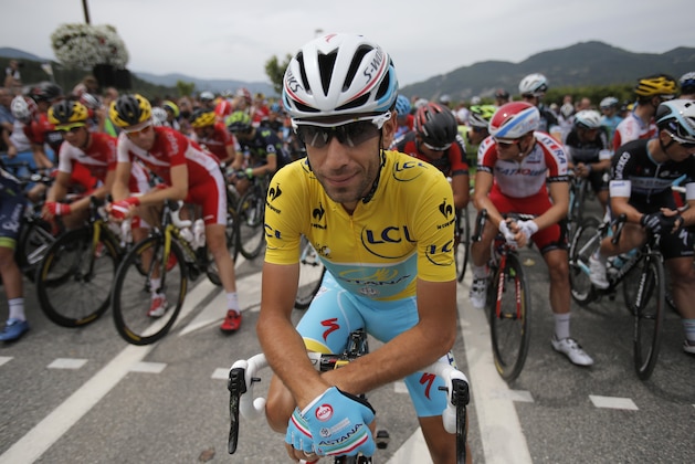 Italy's Vincenzo Nibali, wearing the overall leader's yellow jersey, poses for photographers prior to the fifteenth stage of the Tour de France cycling race over 222 kilometers (137.9 miles) with start in Tallard and finish in Nimes, France, Sunday, July 20, 2014. (AP Photo/Christophe Ena)