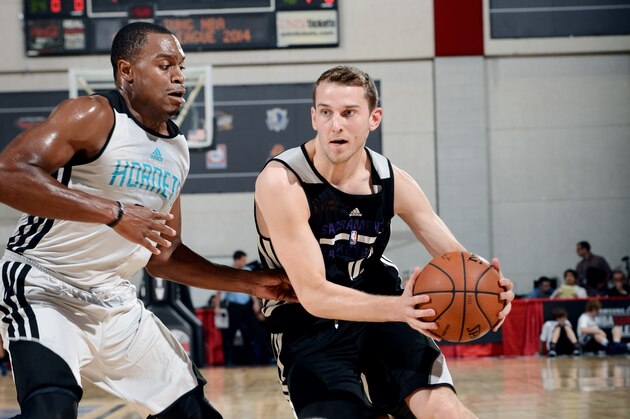 LAS VEGAS, NV - JULY 13: Nik Stauskas #10 of the Sacramento Kings drives against the Charlotte Hornets at the Samsung NBA Summer League 2014 on July 13, 2014 at the Cox Pavilion in Las Vegas, Nevada. NOTE TO USER: User expressly acknowledges and agrees that, by downloading and or using this photograph, User is consenting to the terms and conditions of the Getty Images License Agreement. Mandatory Copyright Notice: Copyright 2014 NBAE (Photo by Garrett Ellwood/NBAE via Getty Images)