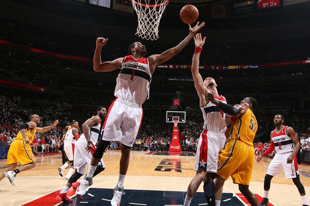 WASHINGTON, DC - MAY 15: Trevor Ariza #1 and Marcin Gortat #4 of the Washington Wizards rebound against Roy Hibbert #55 of the Indiana Pacers in Game Six of the Eastern Conference Semifinals during the 2014 NBA Playoffs at the Verizon Center on May 15, 2014 in Washington, DC. NOTE TO USER: User expressly acknowledges and agrees that, by downloading and or using this photograph, User is consenting to the terms and conditions of the Getty Images License Agreement. (Photo by Ned Dishman/NBAE via Getty Images)