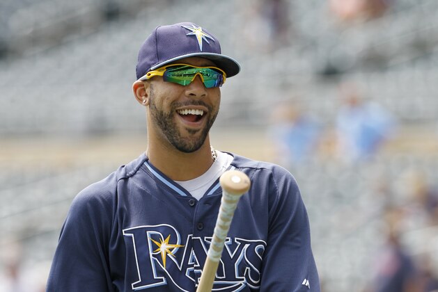 Tampa Bay Rays pitcher David Price laughs with a teammate after taking batting practice before a baseball game against the Minnesota Twins in Minneapolis, Sunday, July 20, 2014.  (AP Photo/Ann Heisenfelt)