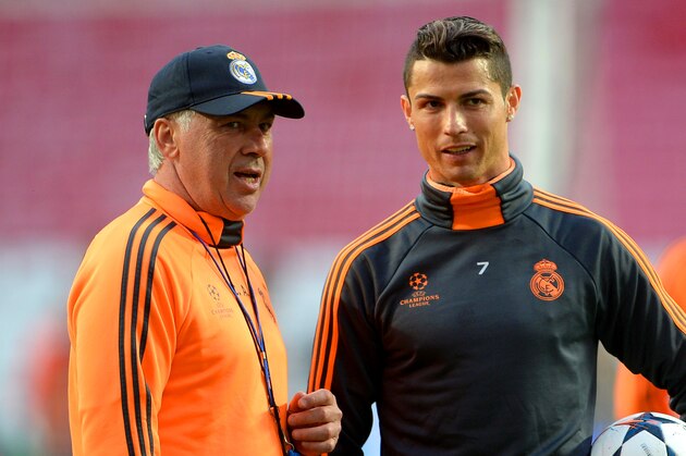 LISBON, PORTUGAL - MAY 23:  Head Coach, Carlo Ancelotti of Real Madrid speaks with Cristiano Ronaldo of Real Madrid during a Real Madrid training session ahead of the UEFA Champions League Final against Club Atletico de Madrid at Estadio da Luz on May 23, 2014 in Lisbon, Portugal.  (Photo by Michael Regan/Getty Images)
