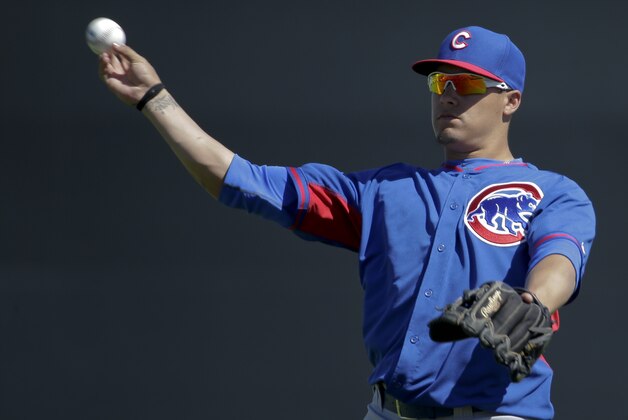 Chicago Cubs shortstop Javier Baez warms up before a spring exhibition baseball game against the San Francisco Giants in Scottsdale, Ariz., Monday, March 10, 2014. (AP Photo/Chris Carlson)