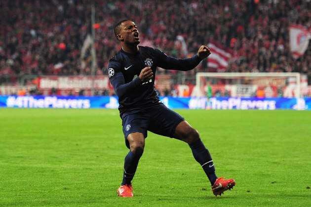 MUNICH, GERMANY - APRIL 09:  Patrice Evra of Manchester United celebrates his goal during the UEFA Champions League Quarter Final second leg match between FC Bayern Muenchen and Manchester United at Allianz Arena on April 9, 2014 in Munich, Germany.  (Photo by Shaun Botterill/Getty Images)
