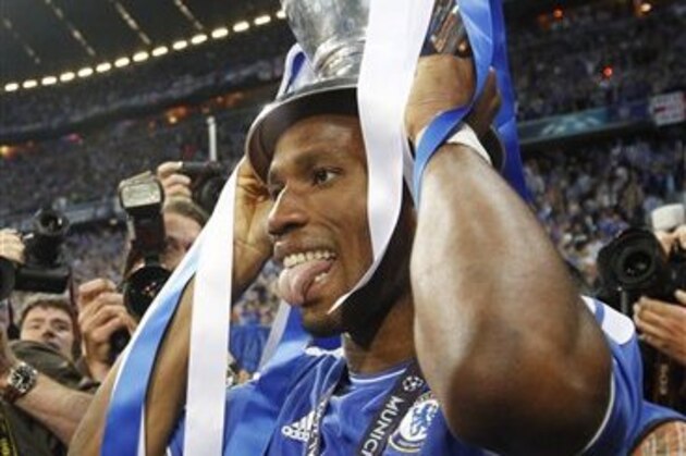Chelsea's Didier Drogba holds the trophy at the end of the Champions League final soccer match between Bayern Munich and Chelsea in Munich, Germany Saturday May 19, 2012. Chelsea's Didier Drogba scored the decisive penalty in the shootout as Chelsea beat Bayern Munich to win the Champions League final after a dramatic 1-1 draw on Saturday. (AP Photo/Matthias Schrader)