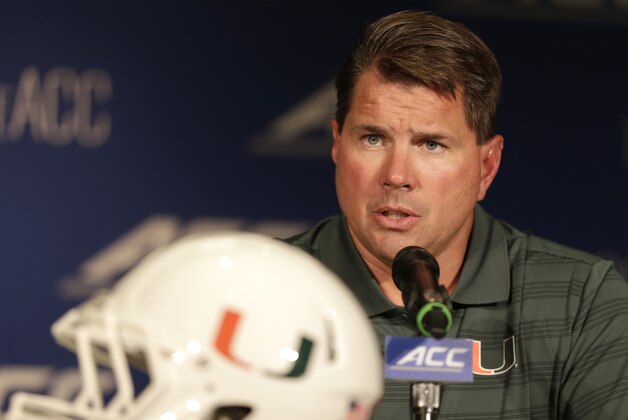 Miami head coach Al Golden answers a question during a news conference at the Atlantic Coast Conference Football kickoff in Greensboro, N.C., Monday, July 21, 2014. (AP Photo/Chuck Burton)
