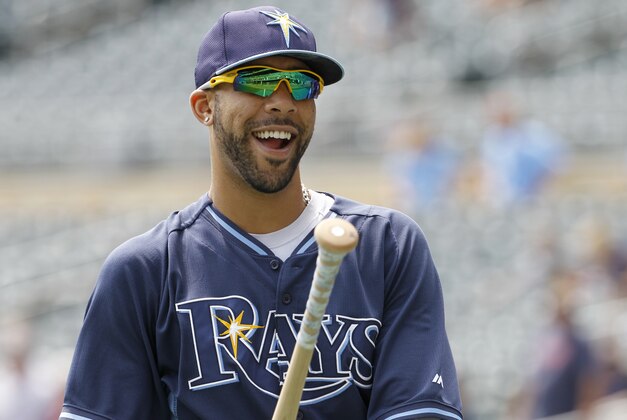 Tampa Bay Rays pitcher David Price laughs with a teammate after taking batting practice before a baseball game against the Minnesota Twins in Minneapolis, Sunday, July 20, 2014.  (AP Photo/Ann Heisenfelt)