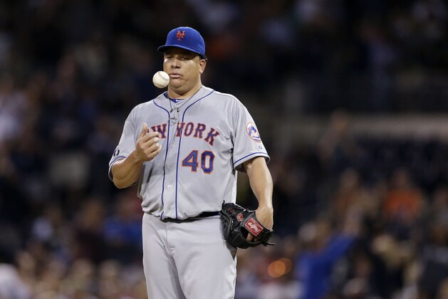New York Mets starting pitcher Bartolo Colon reacts after San Diego Padres' Chase Headly hit a two-run single to tie the baseball game during the fifth inning Friday, July 18, 2014, in San Diego. (AP Photo/Gregory Bull)