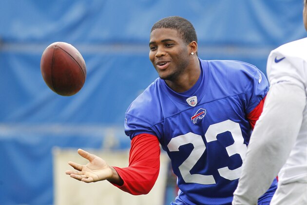 Buffalo Bills safety Aaron Williams (23) flips a ball after taking part in drills during an NFL football organized team activity in Orchard Park, N.Y., Thursday, May 29, 2014. (AP Photo/Bill Wippert)
