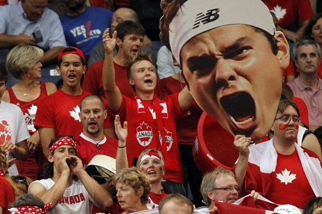 Canada fans react during the Davis Cup semifinal tennis match between Milos Raonic of Canada and Novak Djokovic of Serbia, in Belgrade, Serbia, Sunday, Sept. 15, 2013. (AP Photo/Darko Vojinovic)